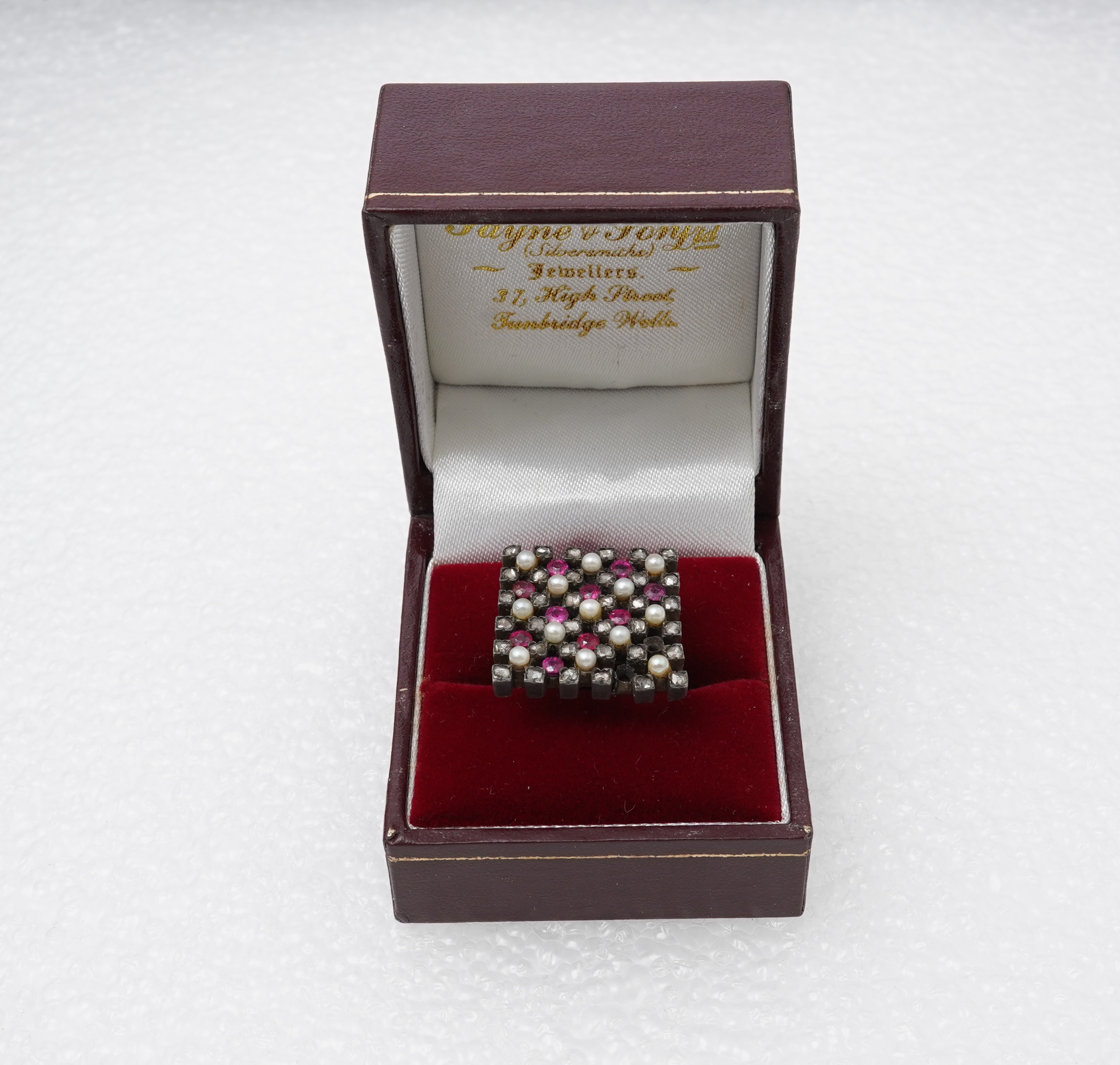 A synthetic ruby, seed pearl and diamond ring